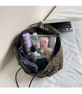 Detailed interior of leopard print tote bag showing large capacity for daily essentials
