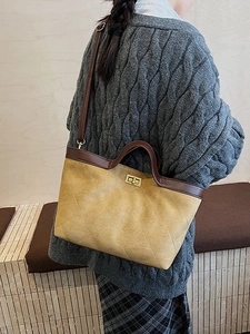Retro mustard yellow suede tote bag with quilted pattern and brown leather straps