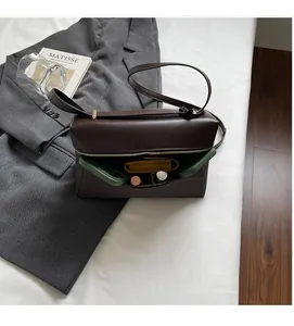 Detail view of deep brown shoulder bag interior showcasing large storage capacity