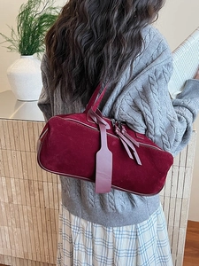 Retro burgundy suede pillow bag for women featuring a minimalist French aesthetic and long strap