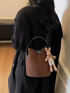 Brown frosted bucket bag with black leather handles and cute rabbit plush pendant