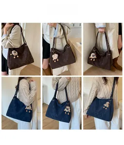 Close-up of matte retro tote bag featuring a cute lamb plush charm with wooden beads