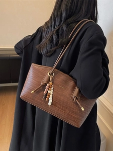 Brown woven texture tote bag for women with retro beaded charm and long shoulder strap