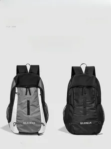 Front view of grey and black nylon backpacks with adjustable straps and side mesh pockets