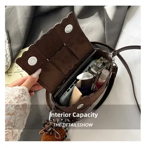 Detail view of leopard print crossbody bag showing spacious interior and card slots