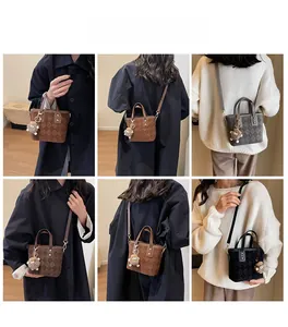 Detail view of retro bucket bags showing embossed textures and various carrying styles