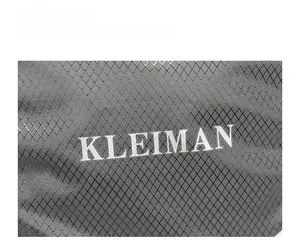 Detail of water resistant diamond textured fabric and white KLEIMAN printed logo on backpack