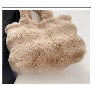 Detailed close-up of soft khaki faux rabbit fur texture on a large capacity tote bag
