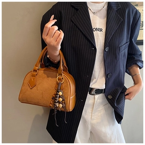 Brown suede and leather Boston bag with vintage wooden bead tassel and double handles