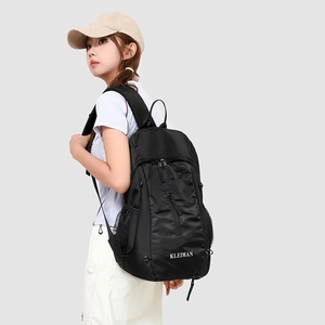 Side view of black lightweight sports backpack with mesh side pockets and large capacity