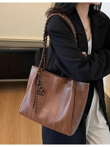 Retro brown large capacity tote bag with woven texture and thick shoulder strap