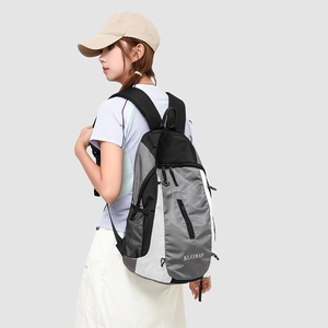 Detail view of the KLEIMAN outdoor backpack showing side mesh water bottle pockets