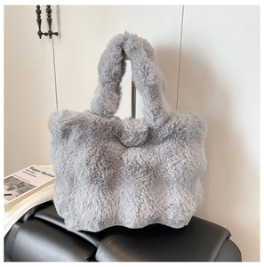 Detail of soft grey faux fur tote bag showing the plush texture and shoulder handles