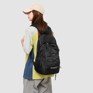 Side view of black lightweight backpack featuring a honeycomb texture and KLEIMAN logo