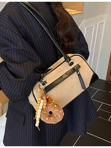 Vintage beige matte suede Boston bag with black leather trim and donut charm