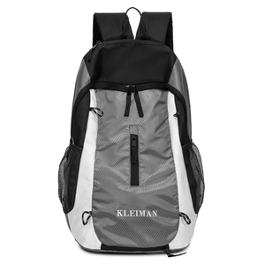 Close-up of diamond pattern nylon fabric and brand logo on a large travel backpack