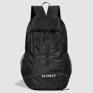 Detail of high-density waterproof nylon fabric and KLEIMAN logo on black backpack