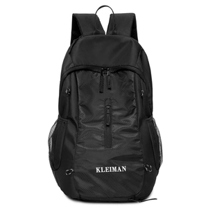 Close-up of black sports backpack with durable nylon fabric and white brand logo