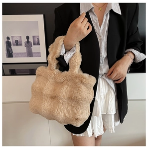 Detail of soft beige faux fur texture on this large capacity winter tote shoulder bag