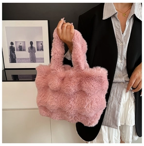 Detail of light pink faux fur tote bag showing quilted texture and soft plush material