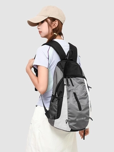 Grey and white lightweight outdoor backpack with honeycomb texture and mesh pockets