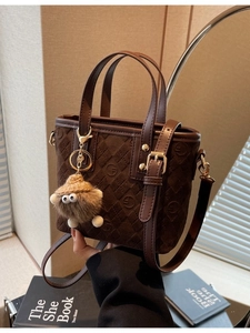 Retro dark brown bucket bag with diamond lattice pattern and plush monster pendant charm