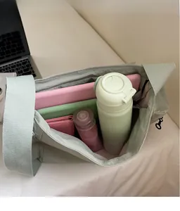 Interior view of light grey tote bag showing spacious storage for daily essentials