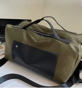 Detail view of large olive green canvas travel bag with soft texture and handles