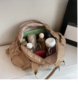 Detailed view showing the large internal capacity of the khaki tote bag for commuters