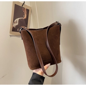 Detailed view of dark brown frosted leather bucket bag with Fashion & Bags embossed logo