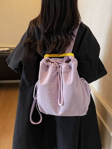 Zaino lilla chiaro minimalista con coulisse e manico giallo per pendolari stile coreano