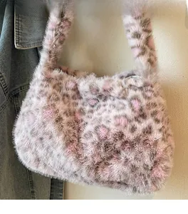 Close-up of leopard print faux fur tote bag with a soft texture and plush handle