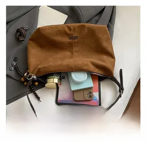 Detail view of large capacity interior for brown vintage tote bag showing ample storage space