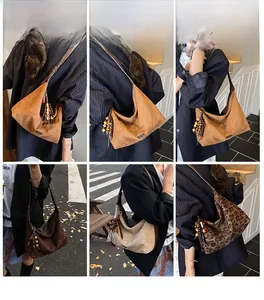Detailed views of vintage hobo tote bag with wood bead tassel and leopard print design