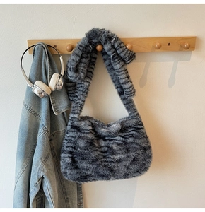 Detail showing plush zebra pattern faux fur texture and comfortable shoulder strap