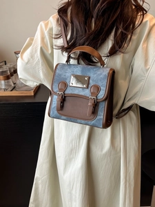 Vintage denim backpack for women with blue fabric and brown leather accents