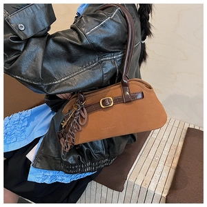 Macro shot of brown frosted leather tote bag with vintage texture and embossed details