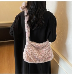 Detail of soft leopard print faux fur shoulder bag with wide comfortable plush strap