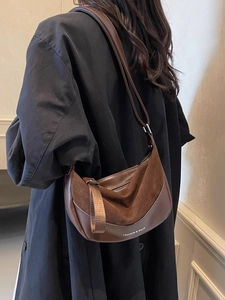 Vintage dark brown saddle shoulder bag with matte leather stitching and wide strap