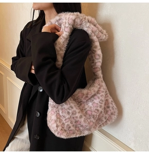 Detailed texture of pink leopard print plush hobo bag with high-quality faux fur finish