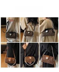 Detail showing the leopard print crossbody bag with silver chain strap on a model