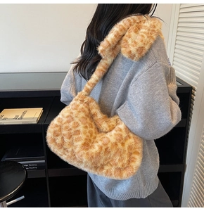 Detail of the plush faux fur texture and classic leopard print on the shoulder bag