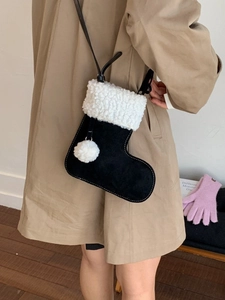 Retro black suede Christmas stocking crossbody bag with white plush faux fur trim detail