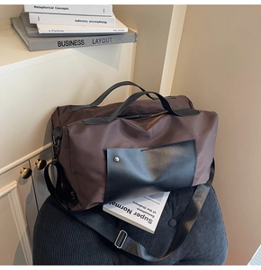 Close-up of a large dark brown canvas travel bag on a corduroy chair in a retro setting