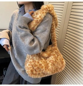 Detailed plush texture of leopard print tote bag with soft faux fur shoulder strap