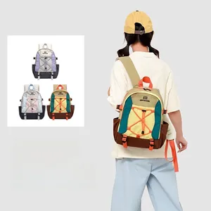 Detail view of large outdoor backpack showing color-block design and elastic drawstrings