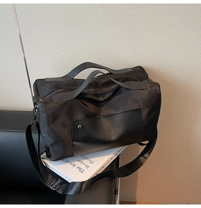 Detail of black canvas travel bag with water-resistant nylon fabric on leather seat