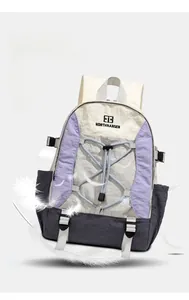 Detail of multi-colored outdoor backpack showing bungee cords and adjustable buckles