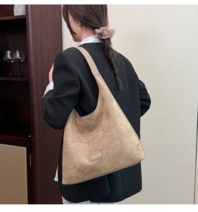 Detail showing khaki leopard print mini bag with adjustable neck strap and fashion style
