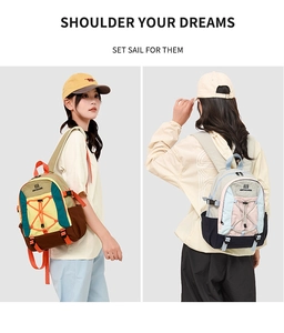 Detail view of large outdoor backpack showing multi-color patchwork design and side buckles